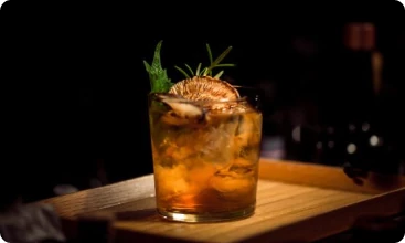 Alcoholic drink in a tumbler glass.